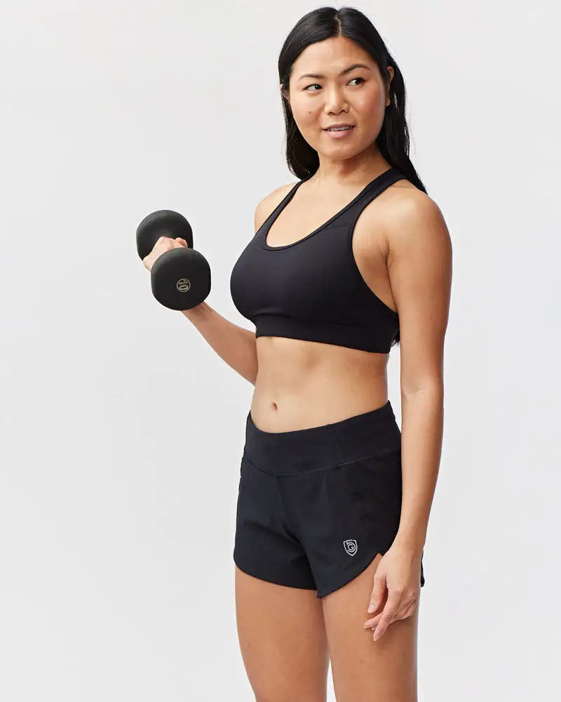 Black dumbbell with smooth matte finish and circular logo designed for excel women’s black camouflage athletic workout shorts use
