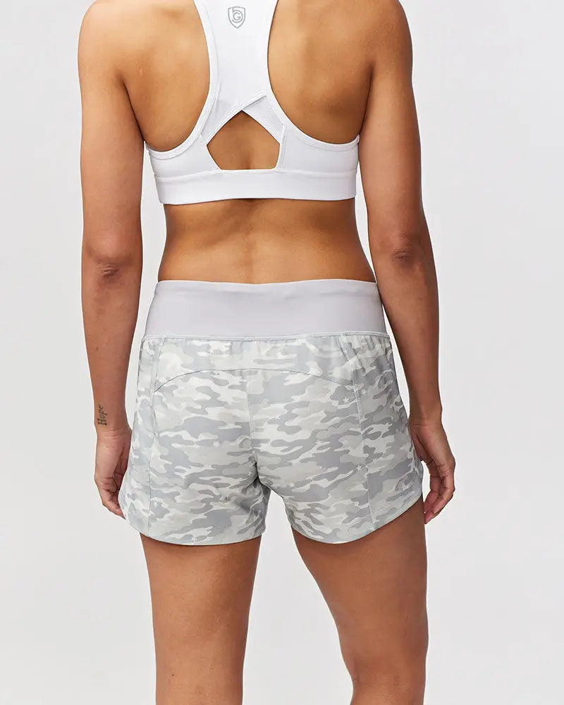 Excel women’s black camouflage athletic workout shorts featuring white and gray camouflage pattern with white elastic waistband