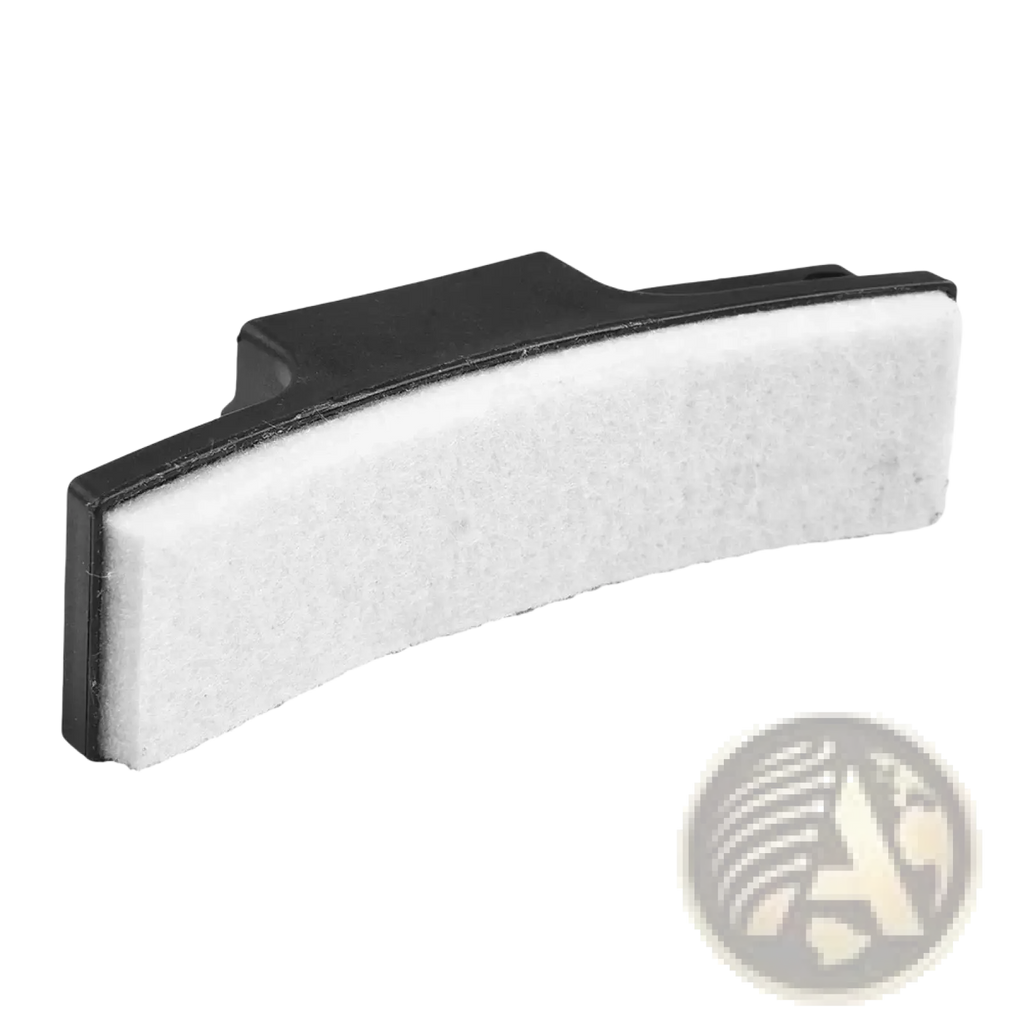 Exercise bike brake pad replacement showing black plastic frame with white abrasive cleaning pad for resistance friction parts