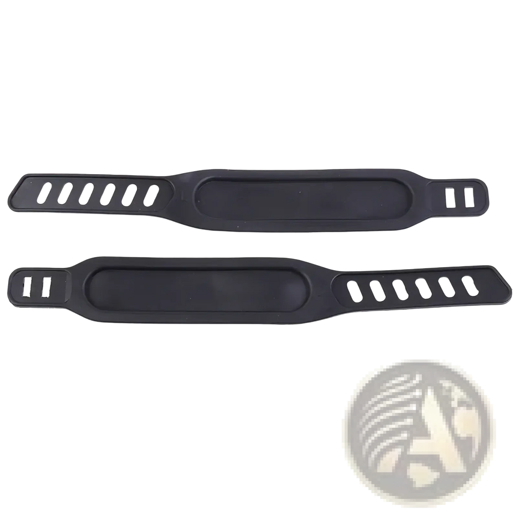 Black silicone exercise bike pedal straps pair with elongated central padding and oval cutouts for grip and comfort