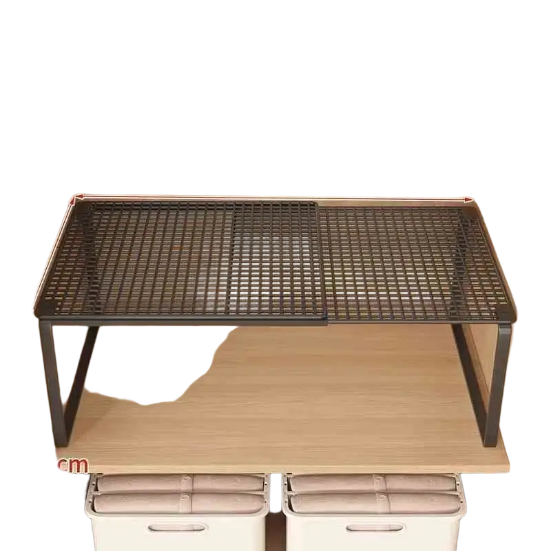 Black expandable cabinet shelf in carbon steel with adjustable width and sturdy metal mesh frame for versatile storage