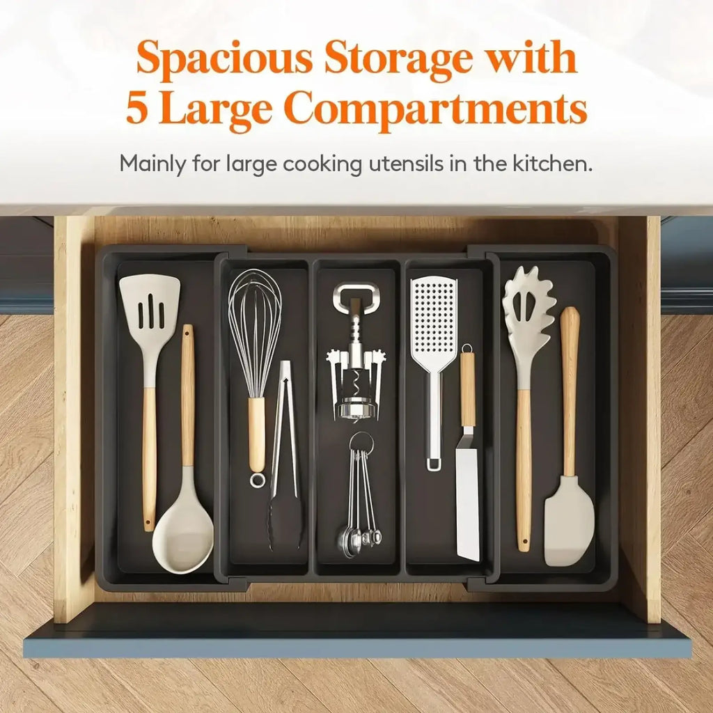 Black plastic expandable kitchen silverware drawer organizer tray with five large compartments holding utensils