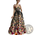 A black floor-length tulle prom gown with vibrant 3d floral appliqués in pink purple yellow and orange