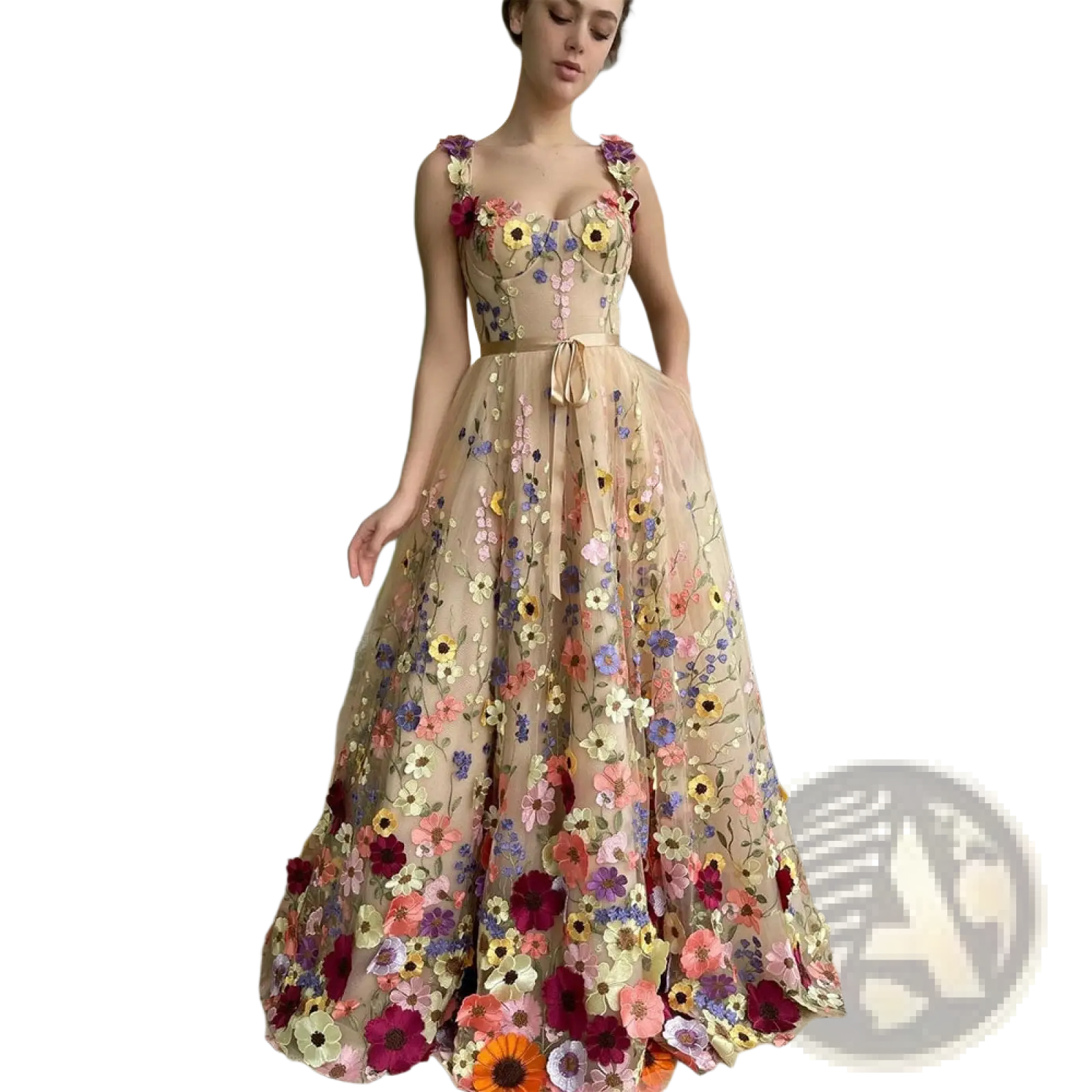 A woman wears a beige floor-length tulle prom gown with vibrant 3d floral embroidered sweetheart neckline