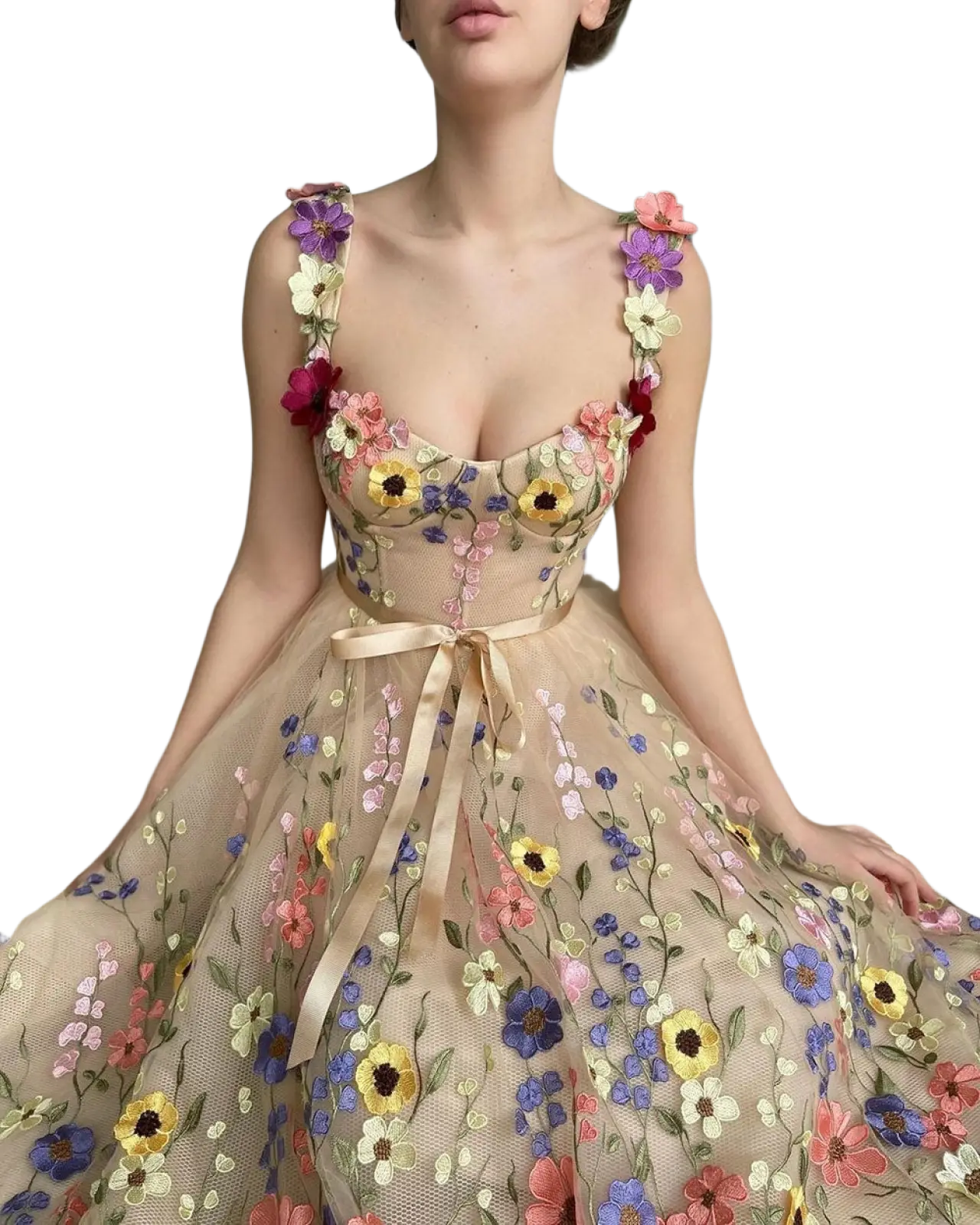 A delicate sheer beige tulle prom gown with 3d floral embroidered purple yellow pink and blue flowers