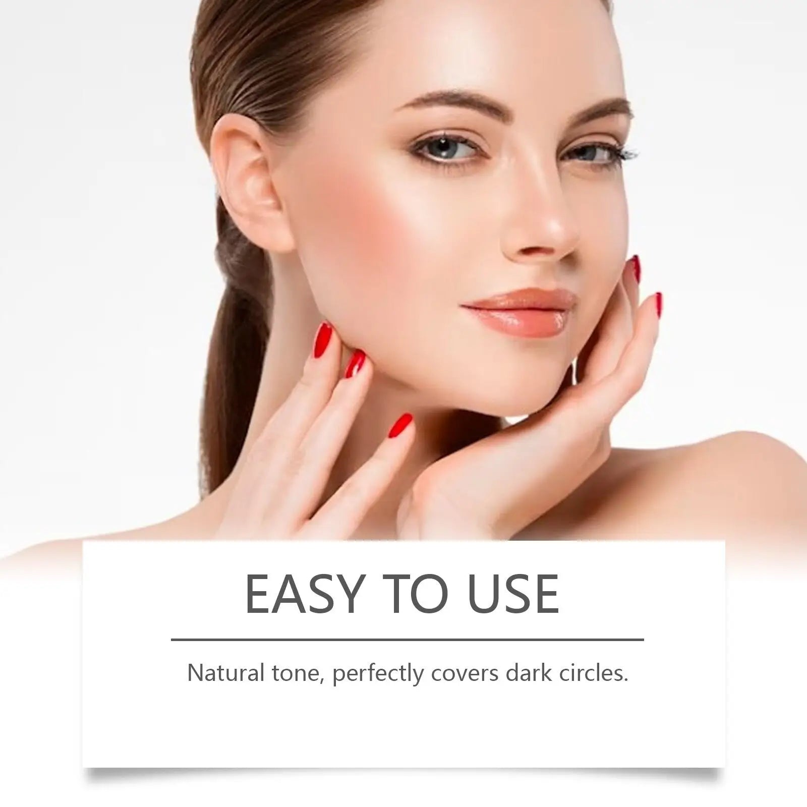 A woman with smooth glowing skin and red nail polish gently touches her face using eye concealer for sensitive skin