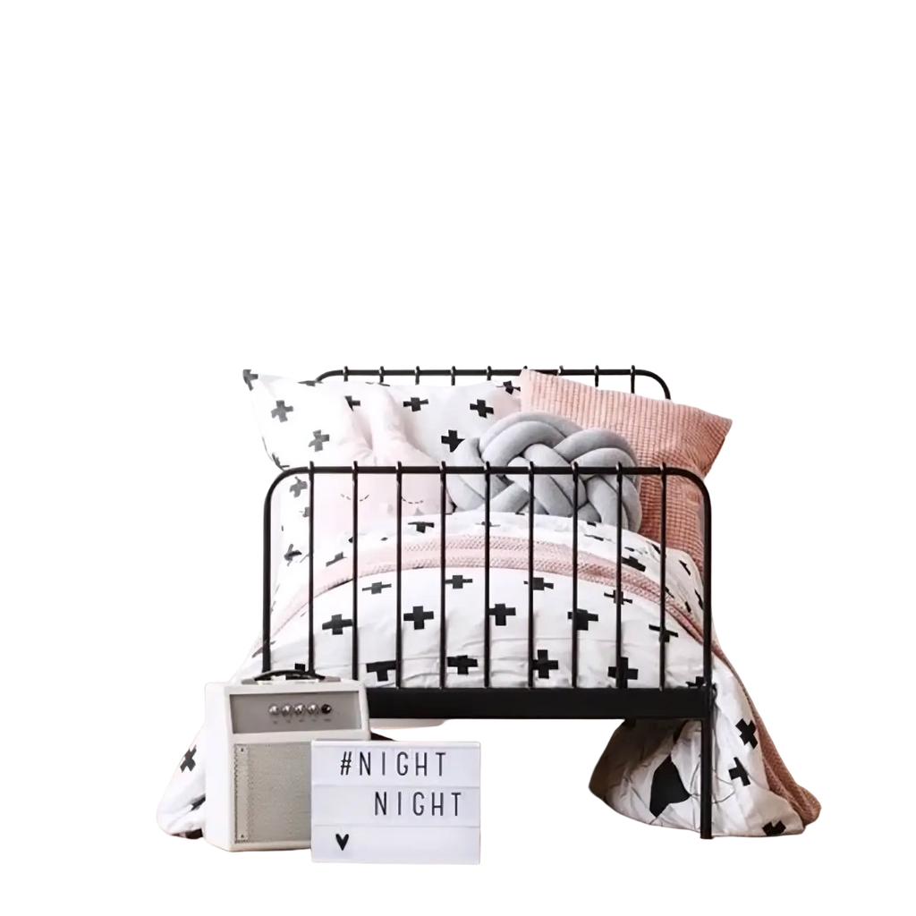 Black metal bed frame with geometric design and decorative pillows in nordic girl bedroom decor setting
