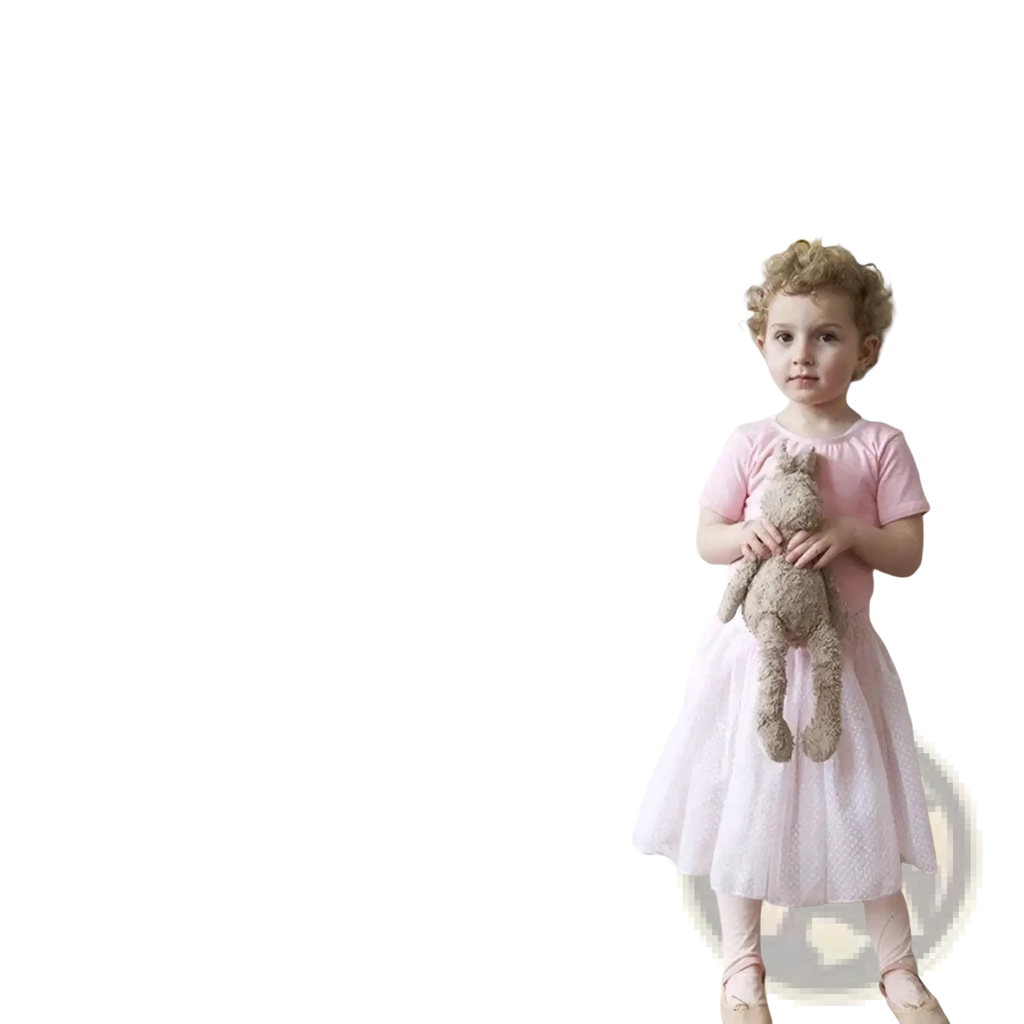 A young girl beside black eyelash wall stickers in a pink dress showcasing Nordic girl bedroom decor