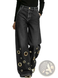 Black wide leg denim jeans with gold toned circular eyelets patterned along the lower legs