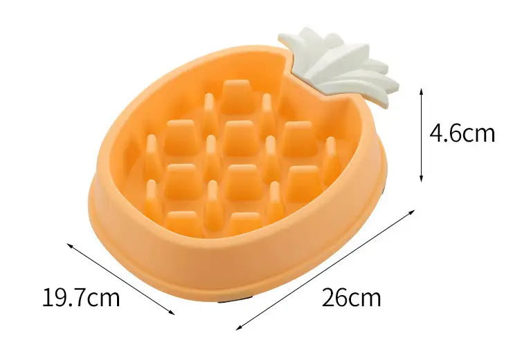 Cuenco para perros de alimentación lenta de silicona con forma de piña color naranja y acento de hoja blanco, diseñado como recipiente de plástico para alimentar a las mascotas lentamente