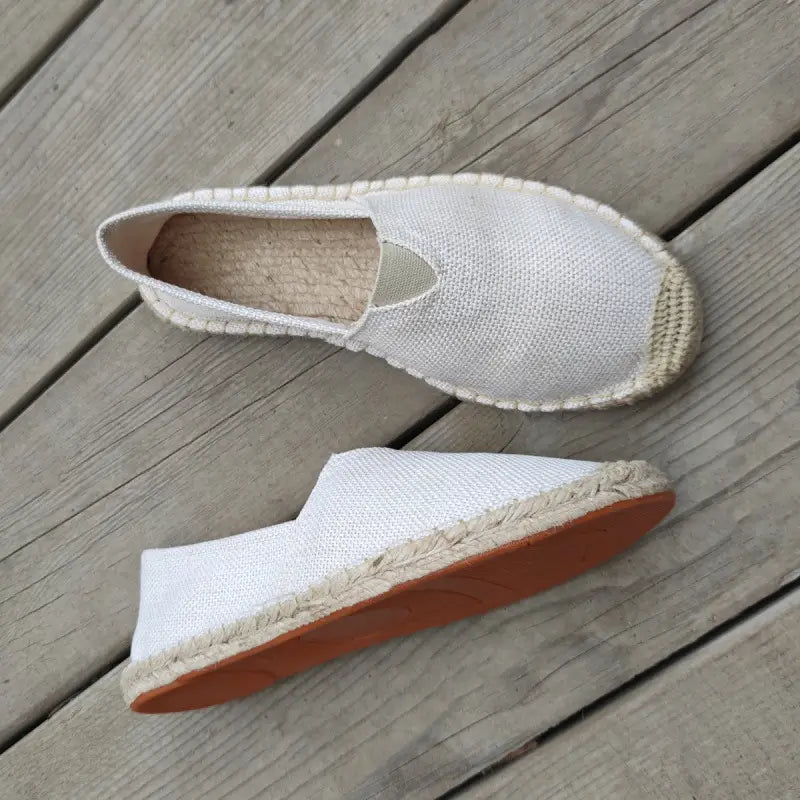 Men’s white linen espadrille slip-on summer shoes with a woven jute sole and tan rubber outsole.