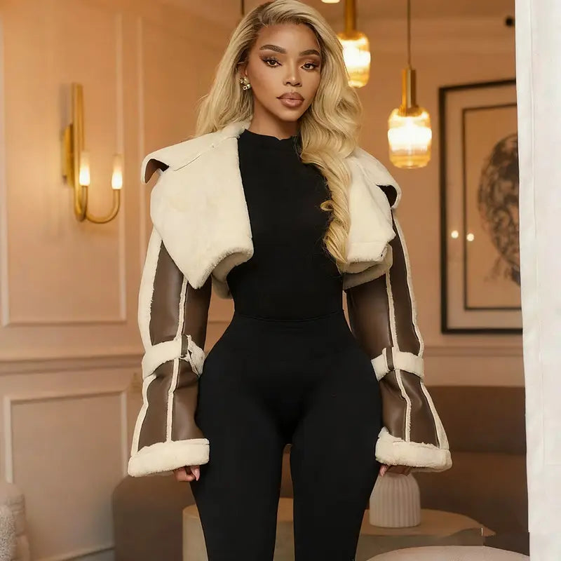 cream-colored shearling leather short jacket for women featuring brown leather panels and white trim with shearling lining.