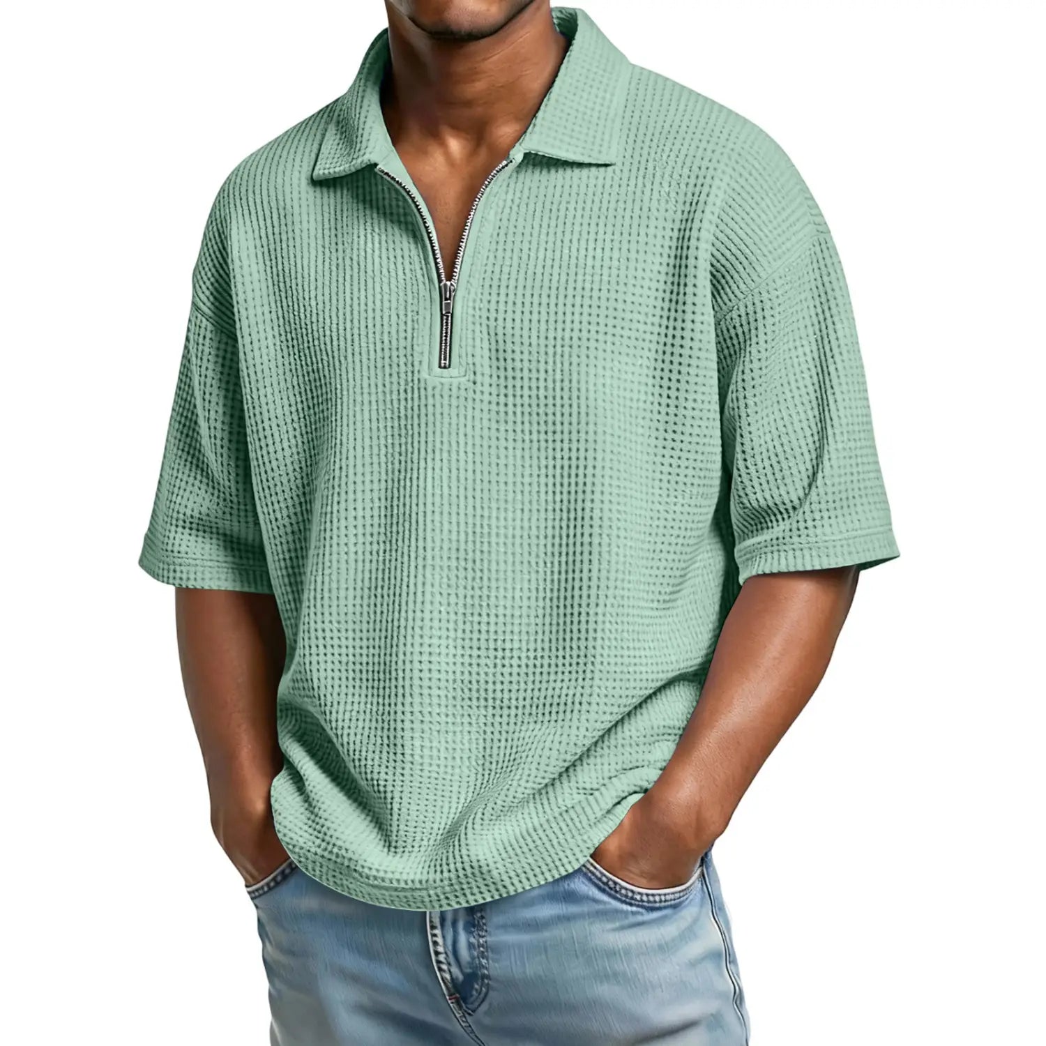 A light green men’s waffle knit polo shirt featuring a half zip front and short sleeves.