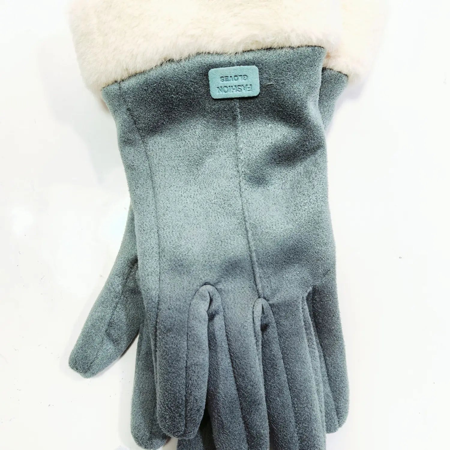 Gray suede women’s thermal touchscreen gloves with plush white fur cuff and small green label shown from the back side.
