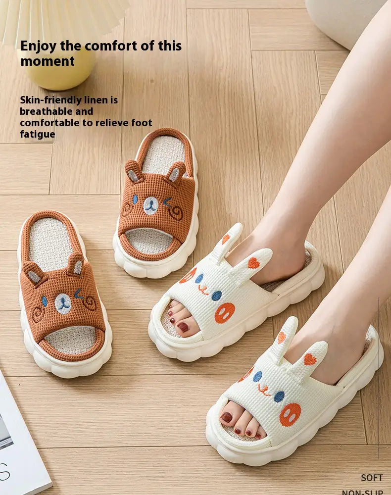 Cartoon animal embroidered open toe linen slippers in brown and white with soft cushioned soles displayed as cute slide sandals.
