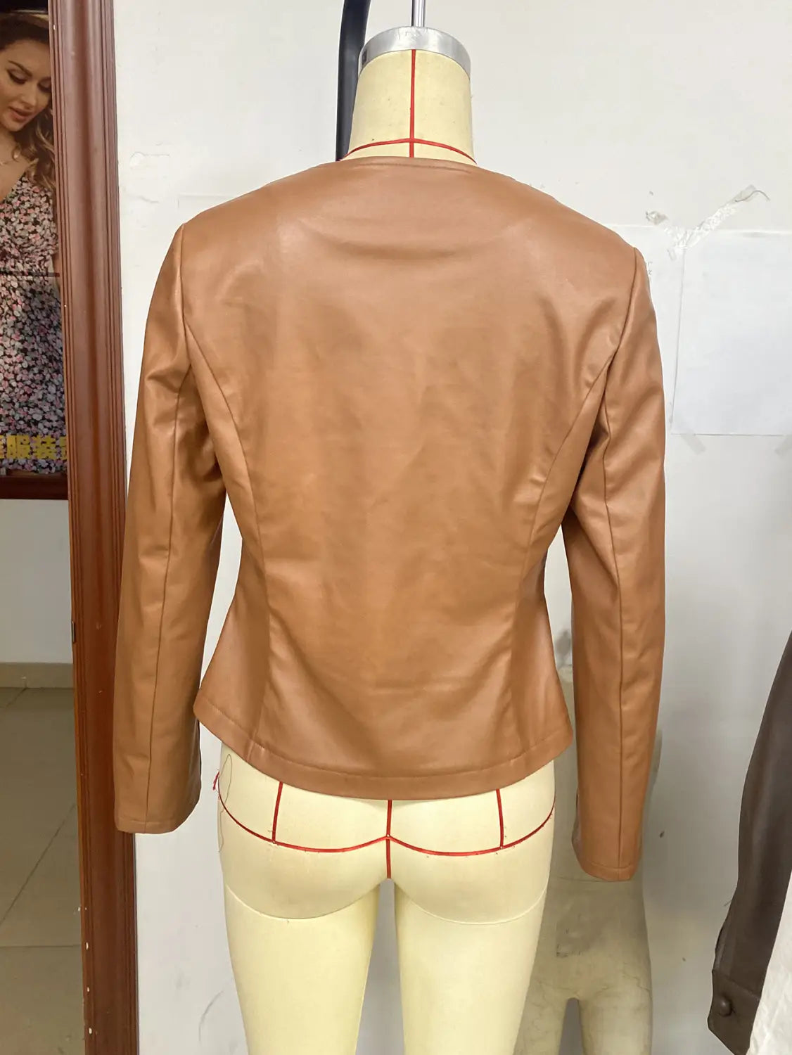 Women’s tan faux leather bomber jacket long sleeve outerwear with a fitted silhouette and subtle seam detailing.