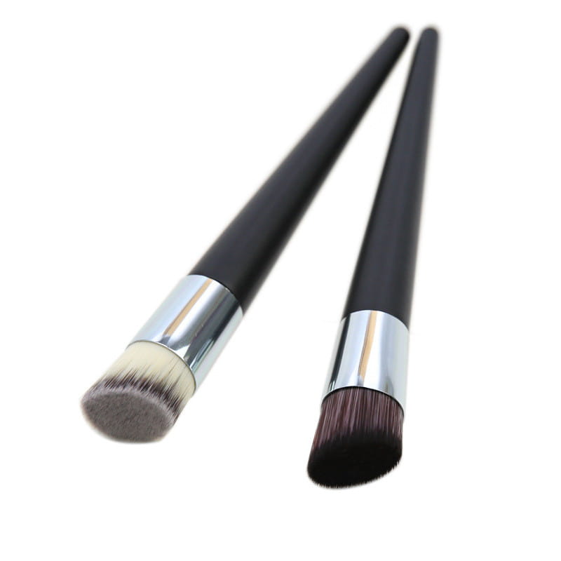 Two black-handled wooden foundation brushes with silver ferrules and soft tapered bristles for angled makeup application.