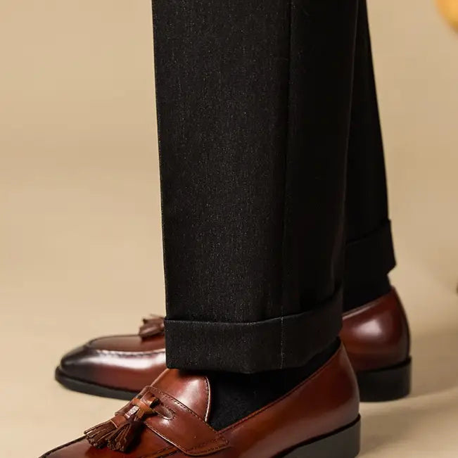 polished genuine leather tassel loafers in black patent leather with a glossy finish and classic design
