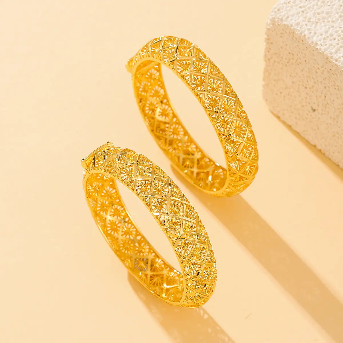 vintage 18k gold plated filigree four leaf clover bangle bracelets showcasing intricate geometric and floral patterns in golden color
