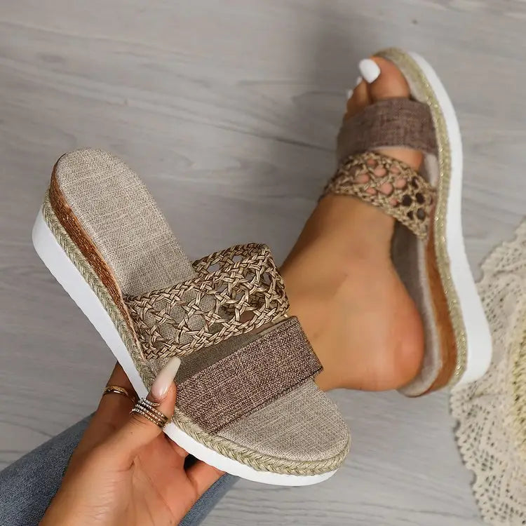 Beige woven mesh espadrille slide sandals with a braided strap and white platform sole for women.