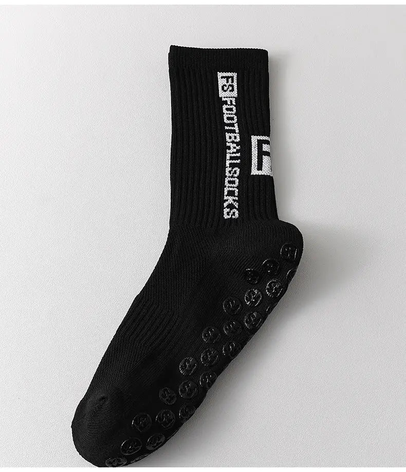 black anti-slip football grip sock for men with textured sole dots and white vertical f3 football socks text near the cuff shown from the back side