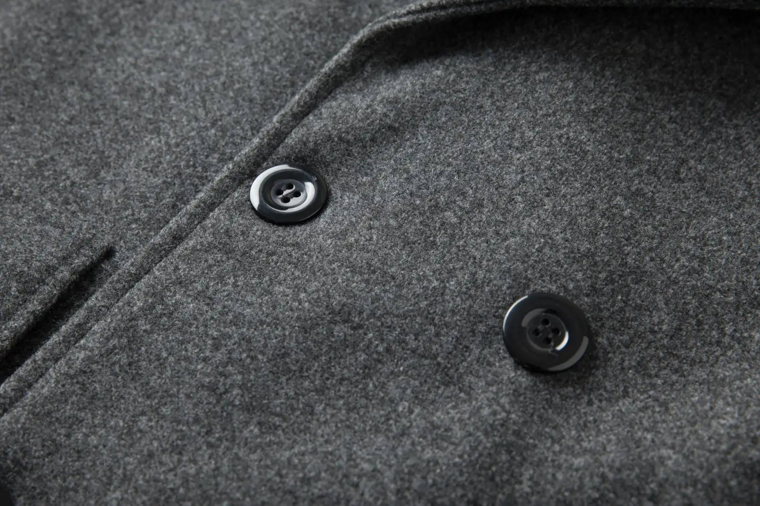 men double breasted wool overcoat mid length coat with black glossy buttons set into textured gray wool fabric