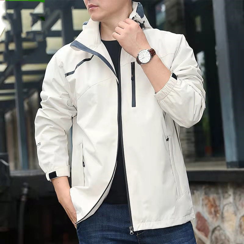 Men waterproof hiking jacket in sleek off-white waterproof material featuring black zipper accents and a camouflage-patterned hood.