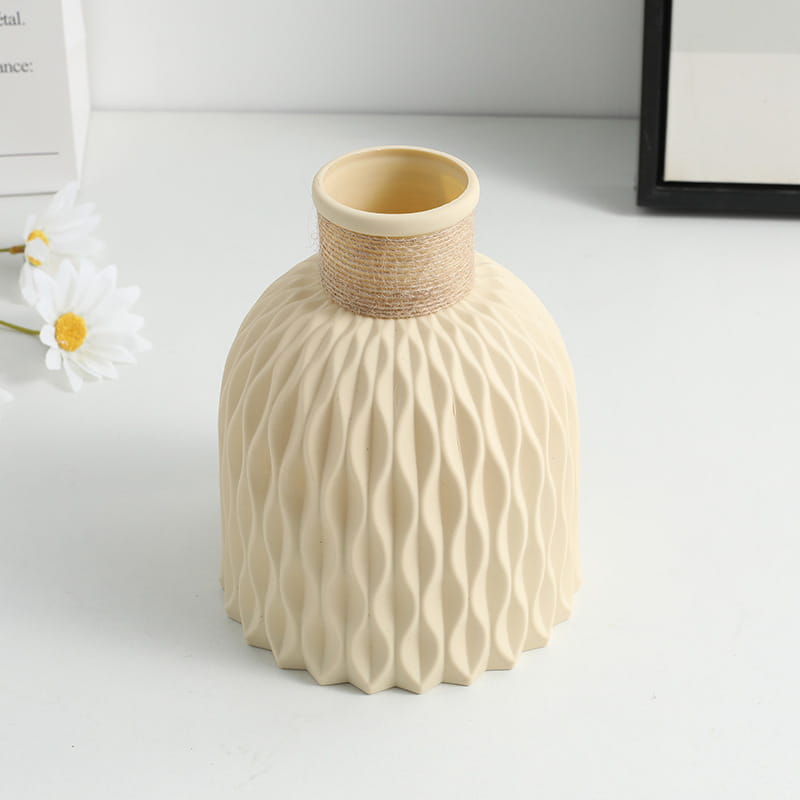 Beige ceramic vase with a textured wavy pattern and natural twine wrapped neck from a ceramic vase set with twine and wavy texture 4 pack.