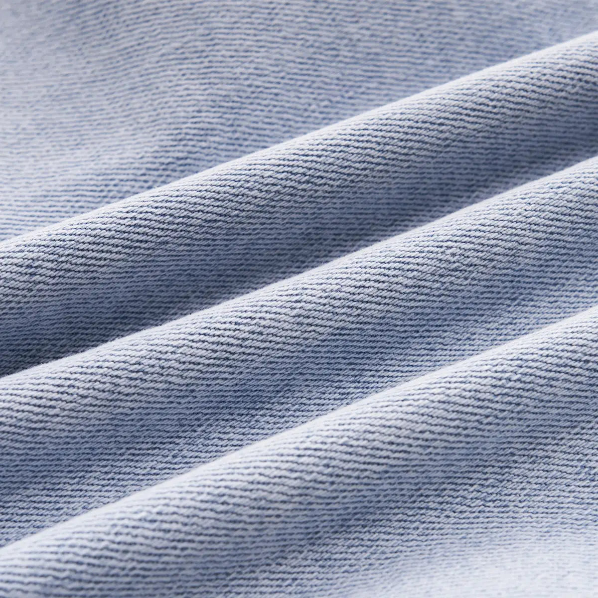 Light blue wide leg stretch denim jeans fabric with a subtle textured weave.