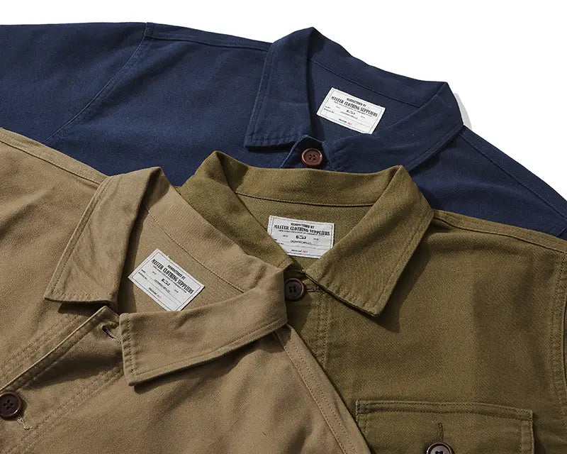 mens french workwear jacket cotton utility pocket coat in navy blue and olive green featuring buttoned collars and branded labels.