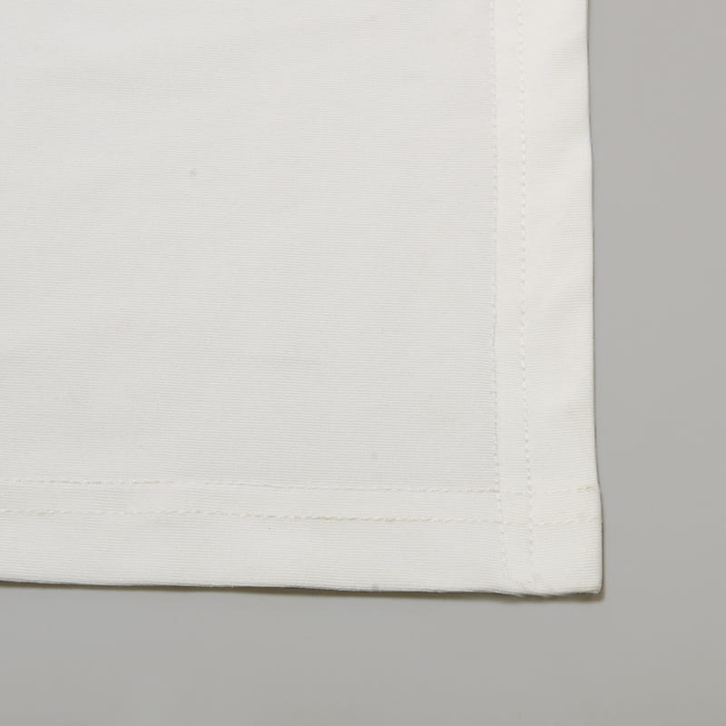 white linen napkin with subtle woven texture and neatly finished edges paired with asymmetrical satin batwing sleeve maxi dress