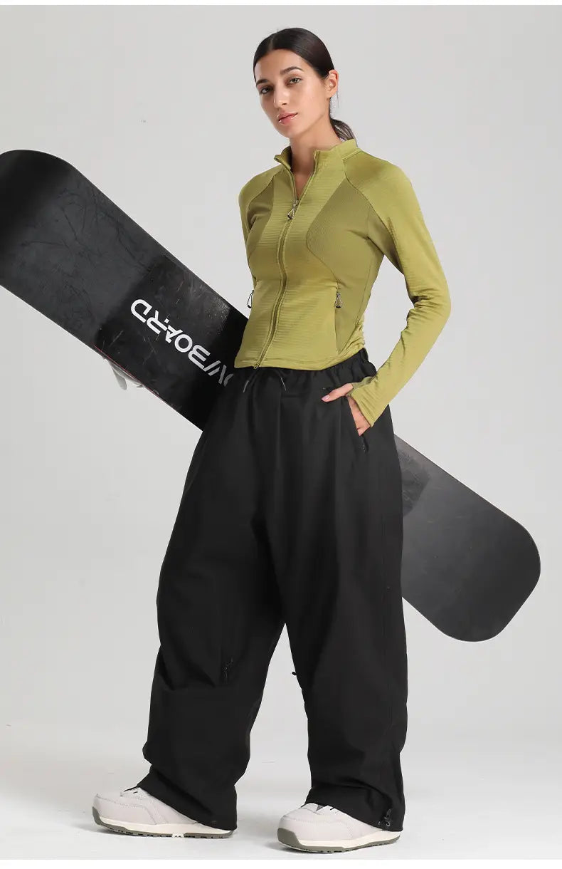 olive green long-sleeved zip-front athletic top paired with waterproof windproof snow pants loose work trousers for outdoor activities.