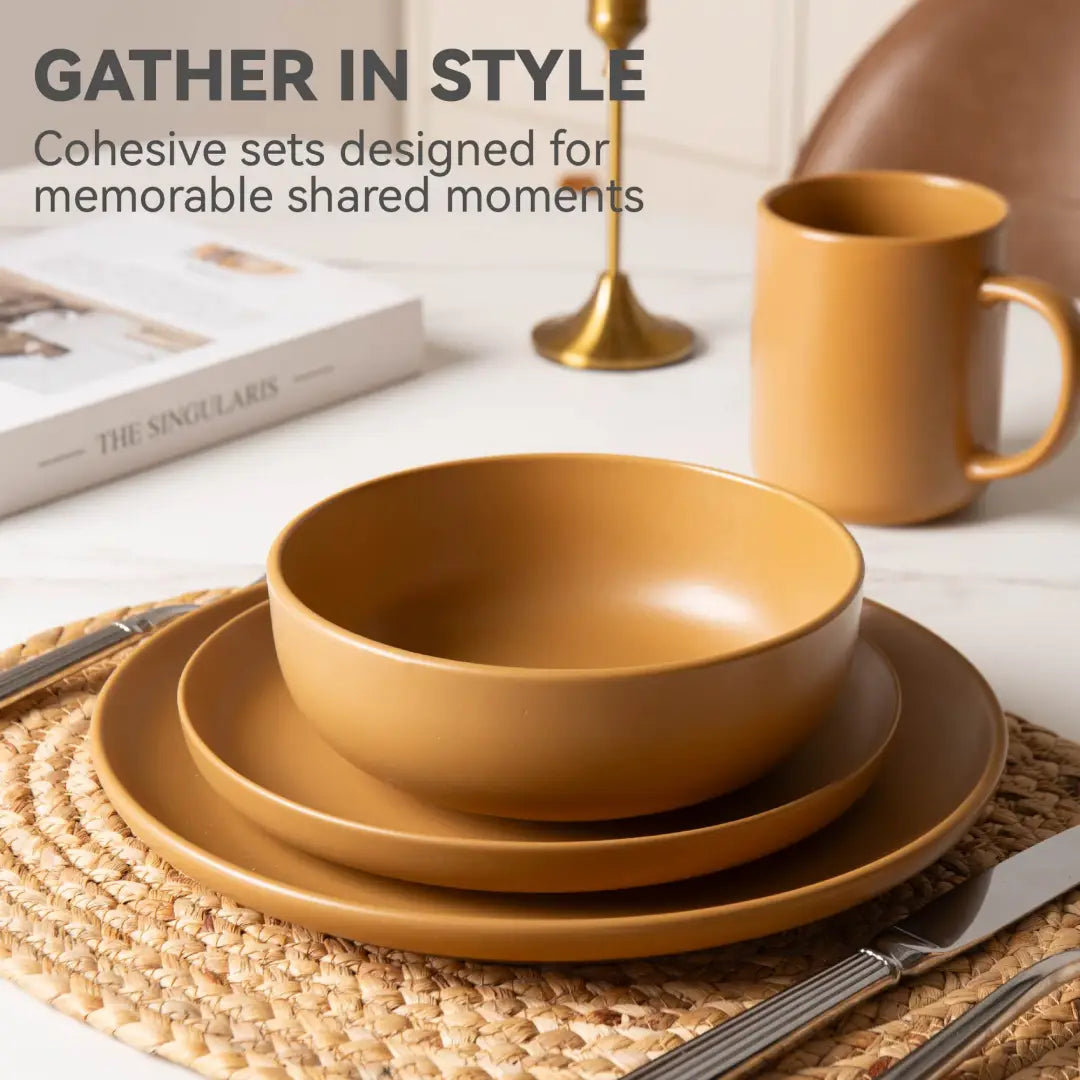 Warm mustard-yellow stoneware ceramic bowl with smooth matte glaze and gently curved rim from a 12 piece dinnerware set for four.