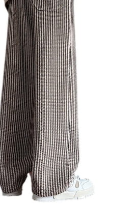 Men wide leg herringbone drawstring trousers featuring black and white vertical striped soft woven fabric.
