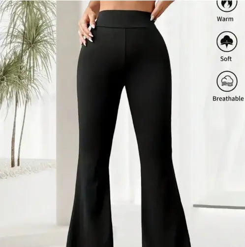 black high-waisted flare yoga pants made from smooth stretchy fabric designed for comfortable movement.