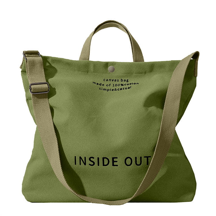 Tan canvas tote bag with high end large capacity black inside out lettering and wooden ring handles.