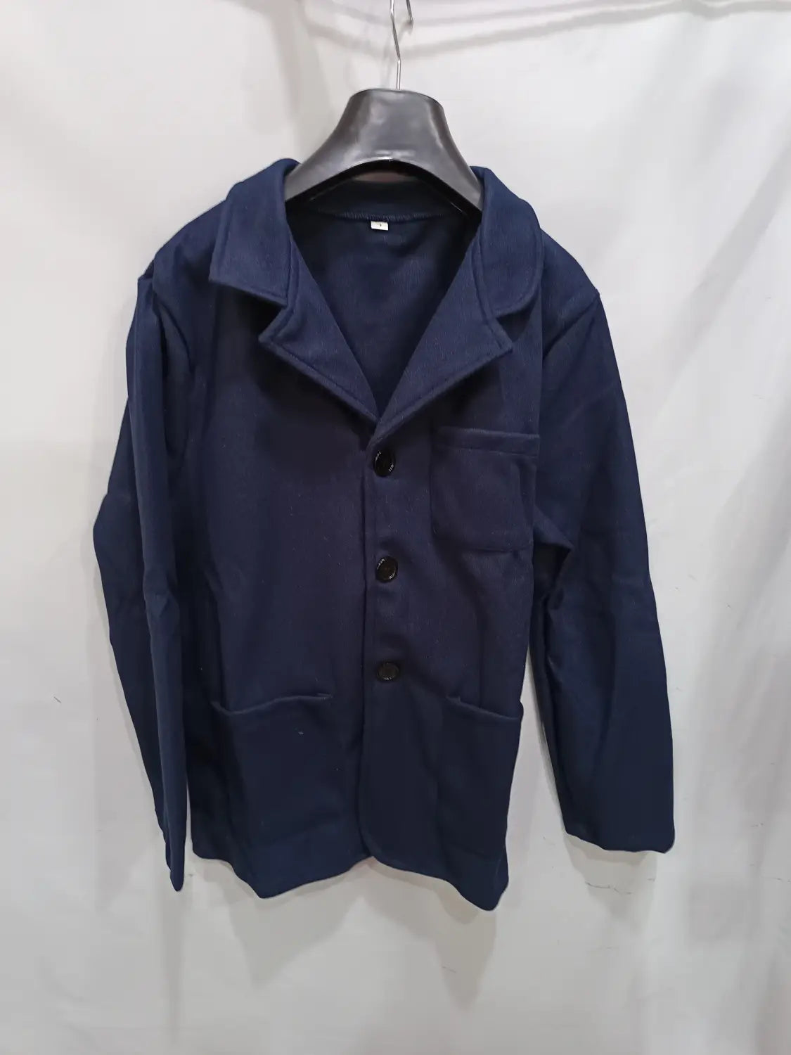 Dark navy blue cotton mens blazer with a classic collar and three black buttons from the wool stand collar slim blazer jacket collection.