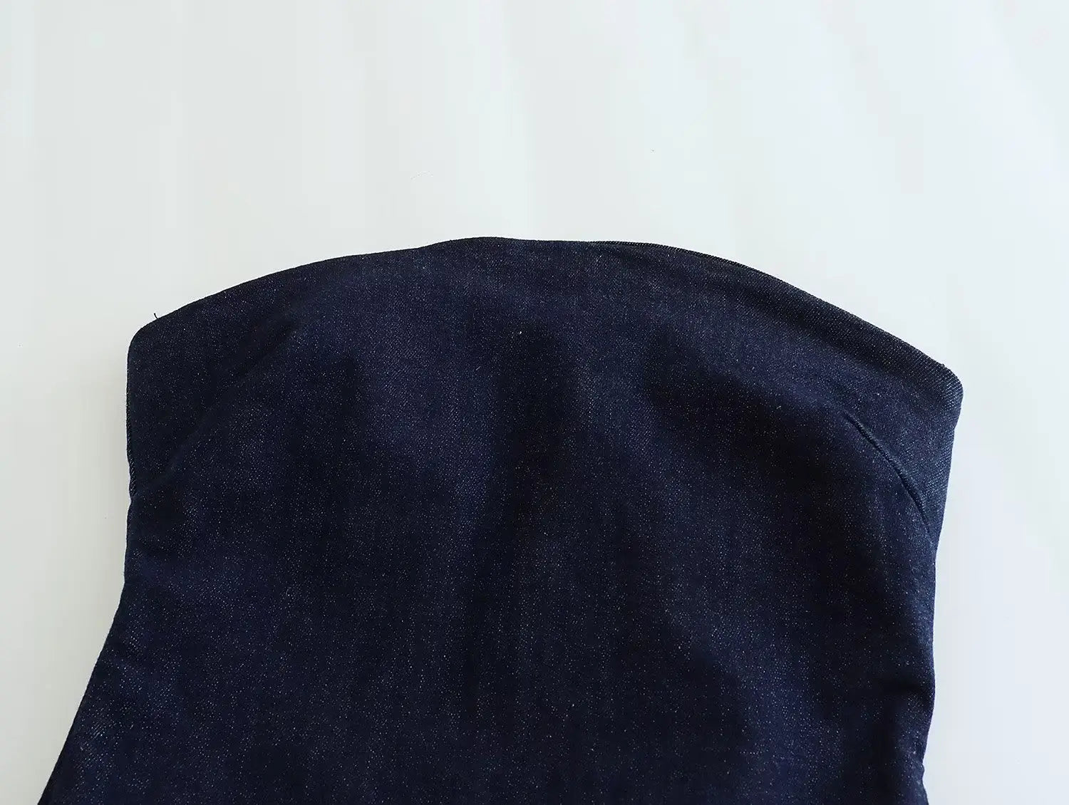 dark blue denim strap with a soft slightly textured fabric finish on a high neck navy velvet zip front maxi dress
