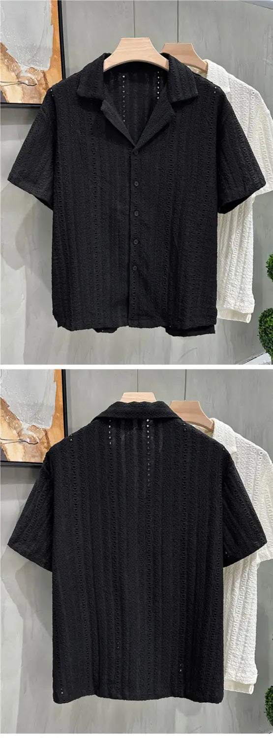 Men Cuban collar short sleeve shirt in black featuring textured eyelet-patterned fabric and subtle vertical stitching details.