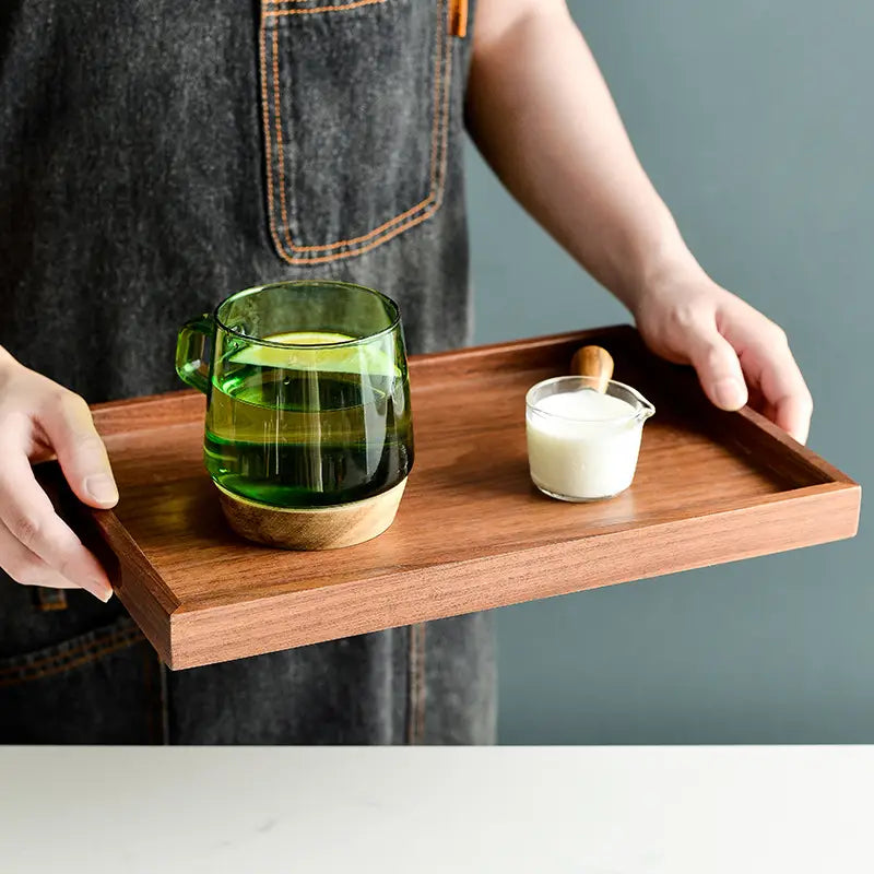 a rectangular acacia wood serving tray with a smooth warm brown finish and rounded corners hand polished for a refined look