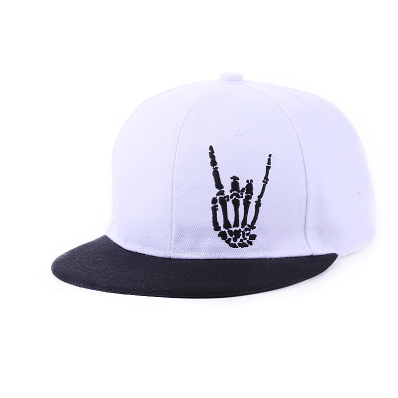 White and black snapback baseball cap featuring a stitched skeleton hand gesture design on the front panel.