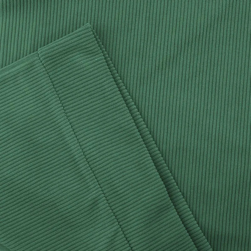 slim fit corduroy patchwork pullover with contrast accents featuring green corduroy fabric with distinct vertical ribs.