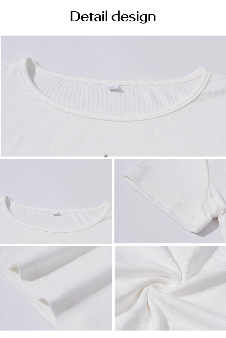 White cotton leopard star slim fit short sleeve crop top with a simple round neckline and soft slightly textured fabric