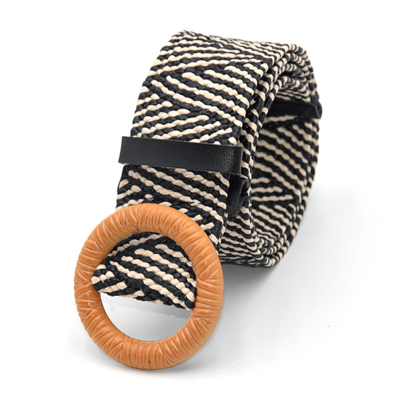 Woven elastic belt featuring black and cream striped fabric with a tan textured circular buckle.