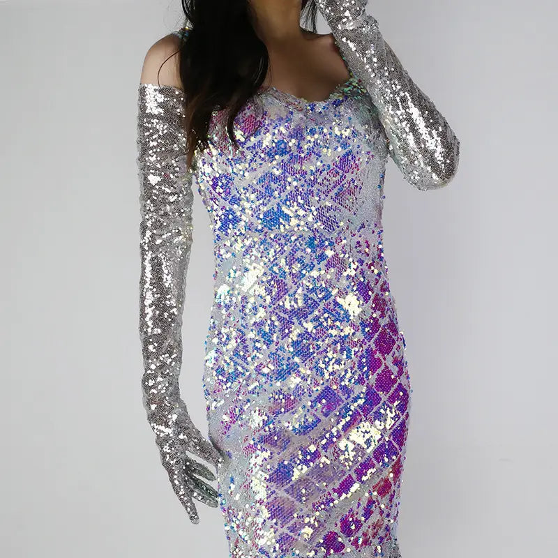 a shimmering iridescent sequined bodycon dress in gradient silver blue and purple hues displayed with a sequined mesh finger gloves set