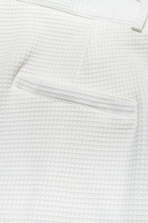 men’s slim fit white waffle knit straight leg business trousers with subtle pocket detail and textured fabric design