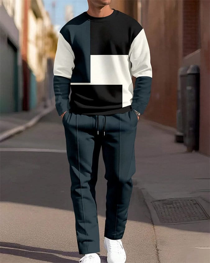 Ensemble sweat à carreaux et pantalon pour hommes, comprenant un sweat-shirt noir, blanc et bleu marine à empiècements contrastants, avec un motif géométrique moderne.