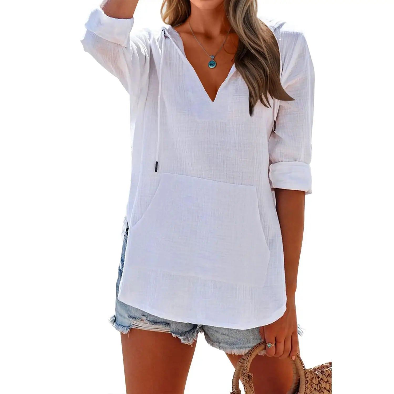 white hooded blouse with a v-neckline and rolled-up sleeves made of cotton linen for women featuring front pockets.