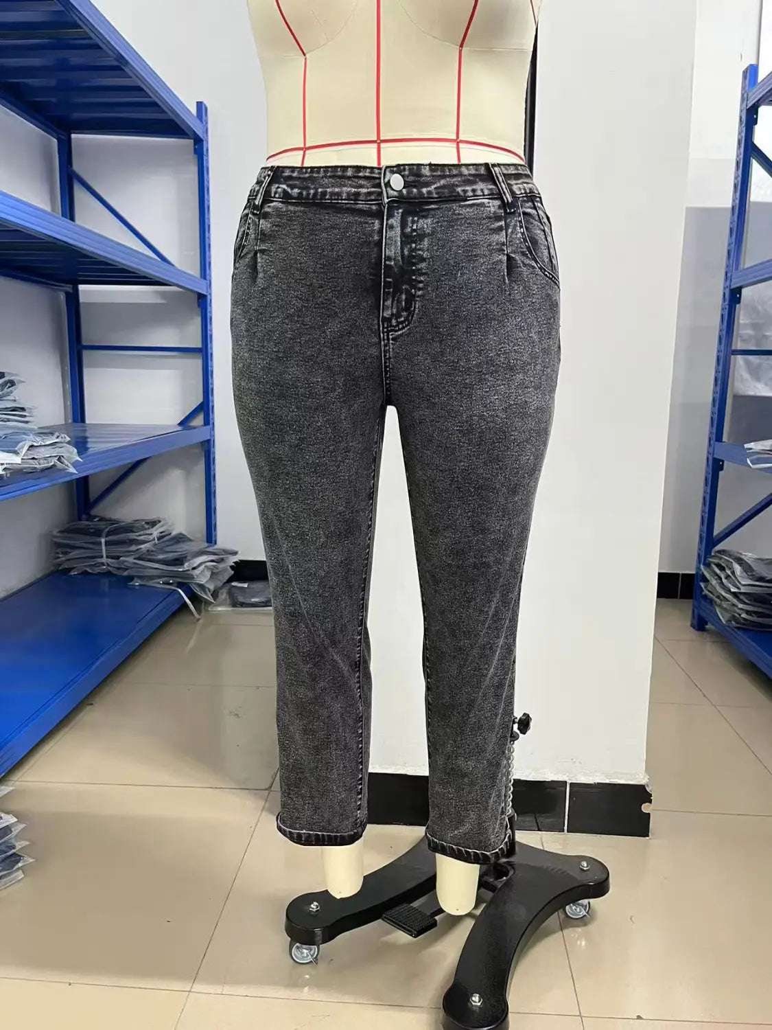 Plus size retro washed tapered denim jeans in dark gray slightly faded denim with a high waist and straight-leg cut displayed on a mannequin.