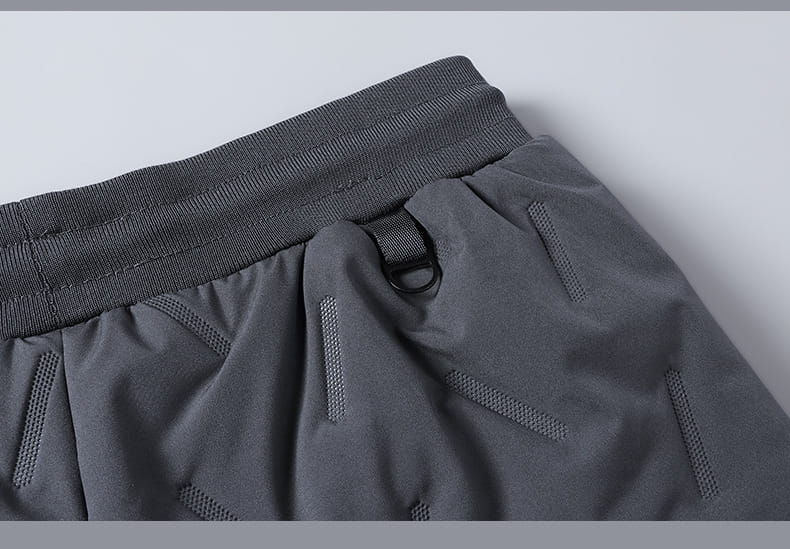 Dark gray thermal fleece lined winter joggers with a ribbed elastic waistband and subtle textured paneling.